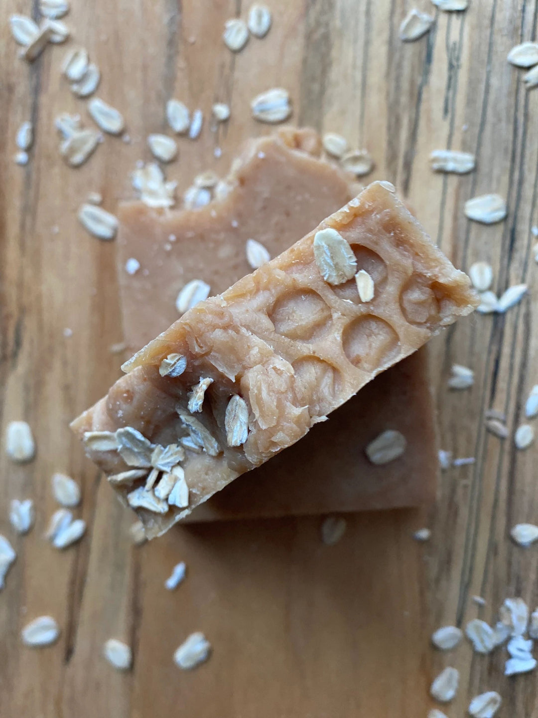 Oats & Honey Milk & Tallow Soap Bar on wooden background